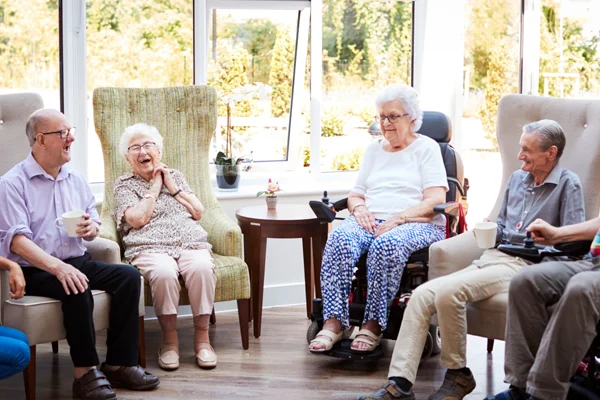 Senior citizens having a social meeting